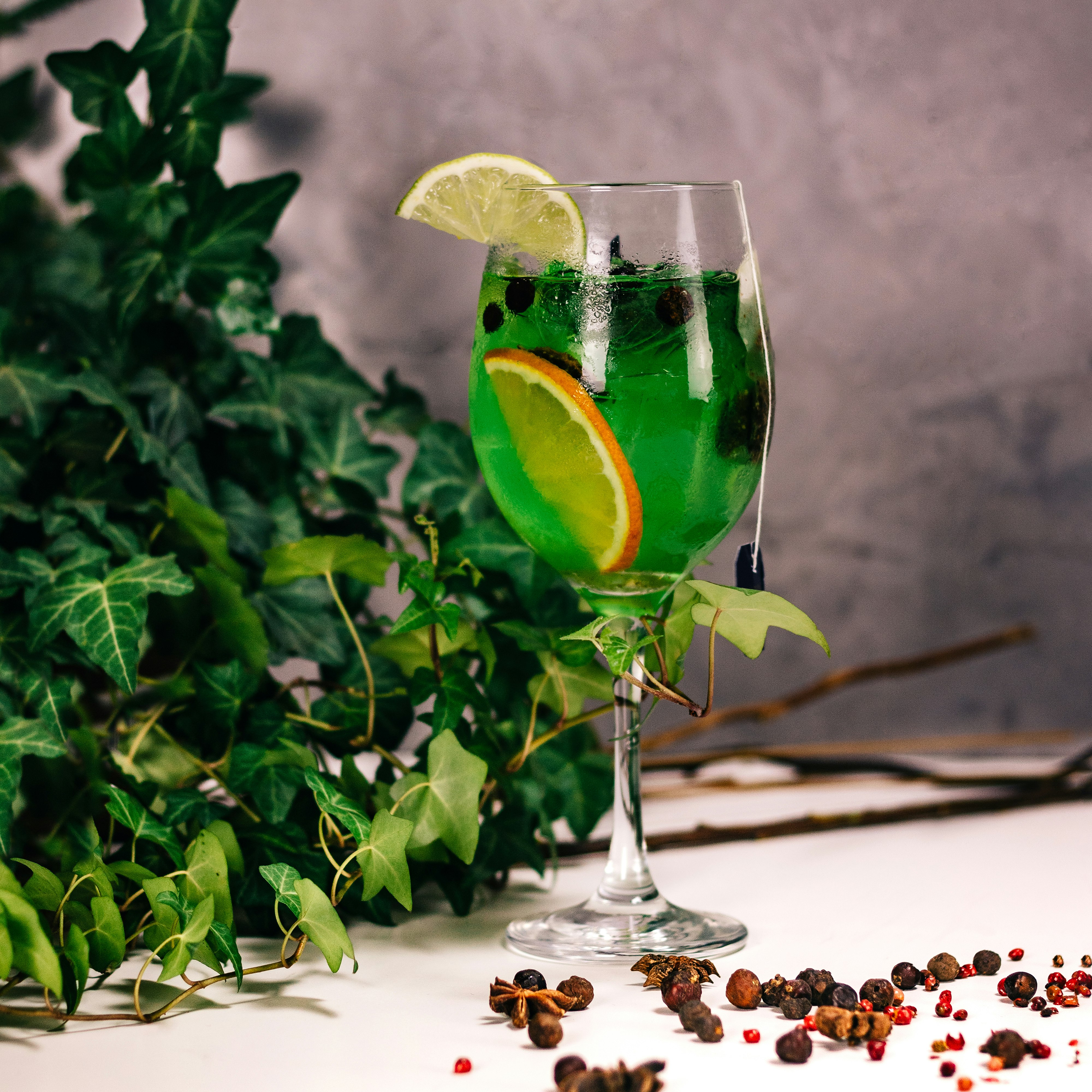 clear wine glass with green liquid